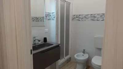a bathroom with a sink and a toilet at Stella di Mare in Balestrate
