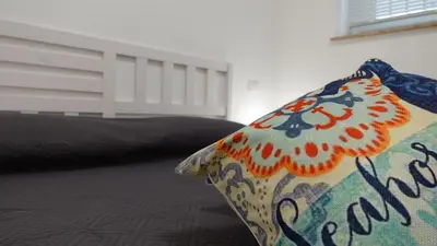 a pillow sitting on top of a bed at Stella di Mare in Balestrate