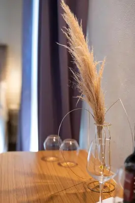 a table with two drinks and bowls of food at Bastione Spasimo Boutique Hotel in Palermo