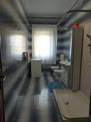 a bathroom with two sinks and a tub and two toilets at La Coccinella 
