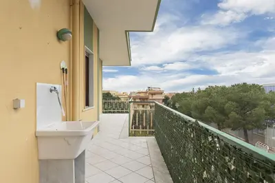 a bathroom with a sink on the side of a balcony at La Coccinella 