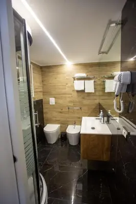 a bathroom with a sink and a toilet at Francesco's Home Palermo in Palermo