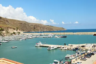 a bunch of boats docked in a harbor at Roberto Guest House in Castellammare del Golfo