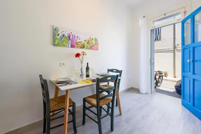 a dining room with a table and chairs at CoralBay San Vito lo Capo - Appartamento in San Vito lo Capo
