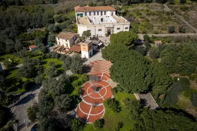 an overhead view of a large house with an orange roof at Agriturismo Villa Cefalà in Santa Flavia