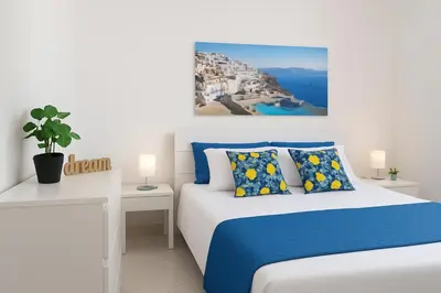 a bedroom with a bed and a view of the ocean at Marea il tuo angolo di paradiso in Sicilia ti aspetta prenota ora e vivi la magia del Mediterraneo in Alcamo Marina