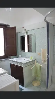 a bathroom with a sink and a mirror at Vacanze Da Laura in San Vito lo Capo