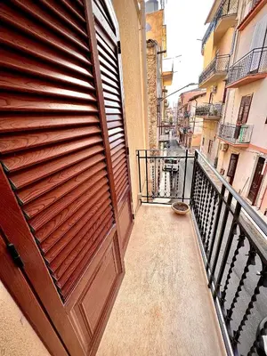 a wooden door on the side of a balcony at Antica Locanda Zio Cesare MONTELEPRE in Montelepre