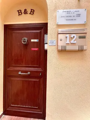a wooden door in front of a building at Antica Locanda Zio Cesare MONTELEPRE in Montelepre