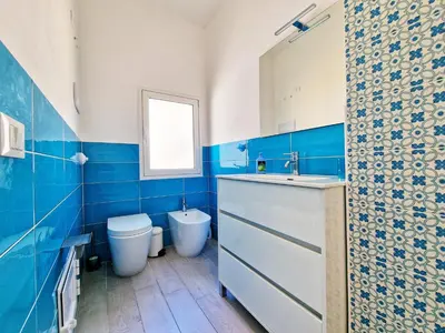 a bathroom with a toilet and a sink at Casa vacanze A&G in Castellammare del Golfo
