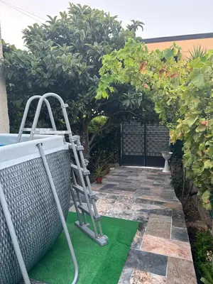 a ladder on a green floor in a garden at Aromi di Sicilia Casa Vacanze in Palermo
