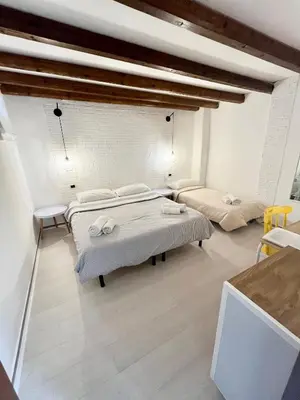a room with two beds in a room at Casa Myrtos in Palermo