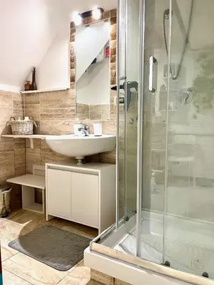 a bathroom with a sink and a shower at Casa Myrtos in Palermo