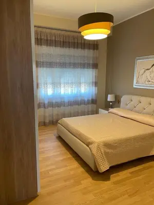 a bedroom with a bed and a window at Dudi Apartment in Palermo