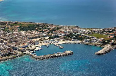 an aerial view of a harbor with boats in the water at Casa del Pescatore in Isola delle Femmine