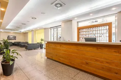 a waiting area in a hospital with a reception counter at Crisol Europa in Palermo