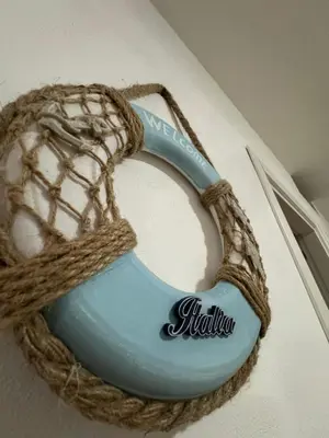 a cake with a rope on top at MC Rooms in Torretta