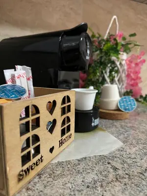 a wooden box sitting on a counter next to a coffee maker at MC Rooms in Torretta