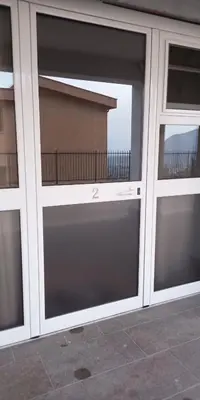 a pair of glass doors on a building at MC Rooms in Torretta