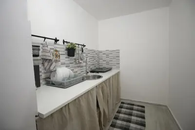 a kitchen counter with a sink in a room at Casa chrilù in Palermo