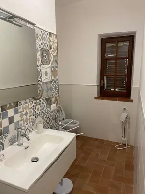 a bathroom with a sink and a toilet at Villa San Vito Bay in Macari