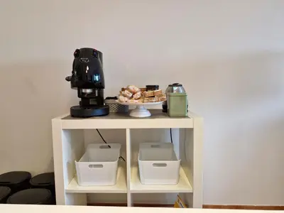 a table with a coffee maker on top of it at Villa delle Pomelie - Castellammare del Golfo in Alcamo
