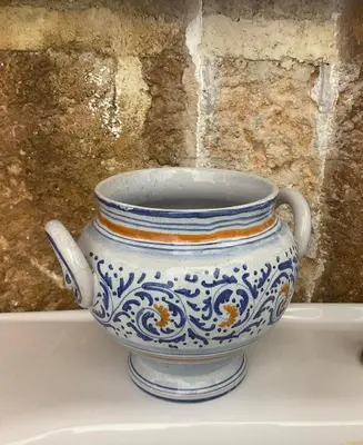 a blue and white vase sitting on a shelf at la Casetta di Laura in Terrasini