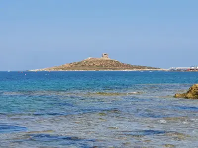an island in the middle of a body of water at La Dependance delle Mimose in Isola delle Femmine