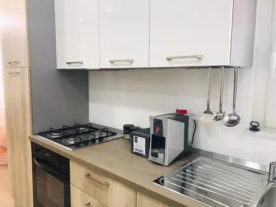 a kitchen with a stove top oven next to a microwave at Casa Vacanze da Peppe in Palermo