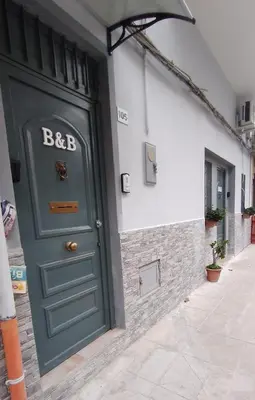 a green door on the side of a building at Casa Vacanze da Peppe in Palermo