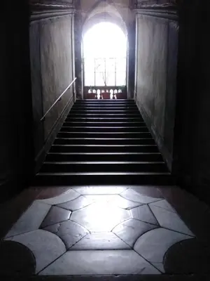 an empty hallway with a large window and stairs at Casamaqueda26, Bilocale indipendente presso palazzo Filangeri-Cutò in Palermo
