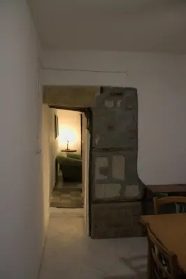 a hallway with a door leading to a room at La Giara in Palermo