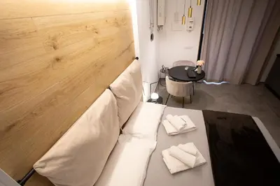 a couch with two napkins on it in a room at LUXURY SUITE SANT ISIDORO in Palermo
