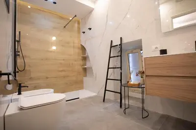 a bathroom with a ladder next to a toilet at LUXURY SUITE SANT ISIDORO in Palermo