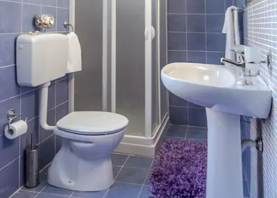 a bathroom with a toilet and a sink at Casa vacanze Biondo in Trappeto