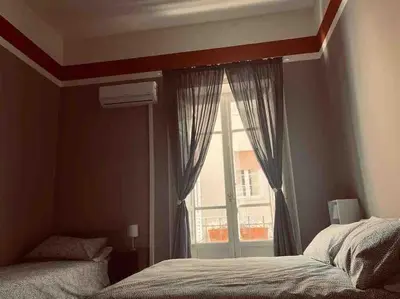 a bedroom with a window and a bed in front of it at 38,VELASQUEZ in Palermo
