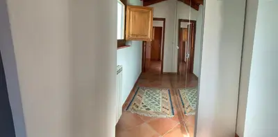 a hallway with a tile floor in a house at Palazzo resuttana in Palermo