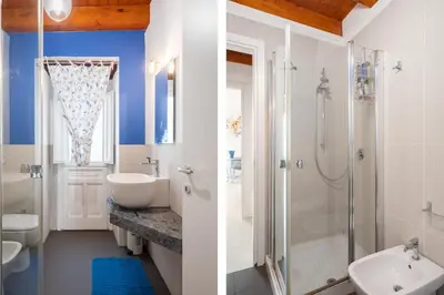 a bathroom with a toilet sink and a shower at Suite San Sebastiano by DomuSicily in Palermo