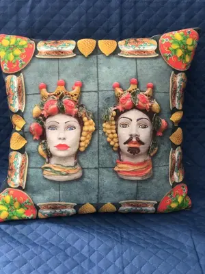 a display of three statues of two women with crowns at Himera Holiday in Palermo