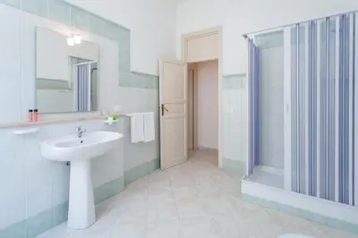 a bathroom with a sink and a shower at B&B Al Piazza Marina in Palermo