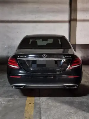 a black car parked in a parking lot at Lorenzo Guest Suite - Garage privato in Palermo