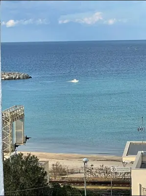 a view of the ocean with a boat in the water at Appartamento Ponente in Balestrate