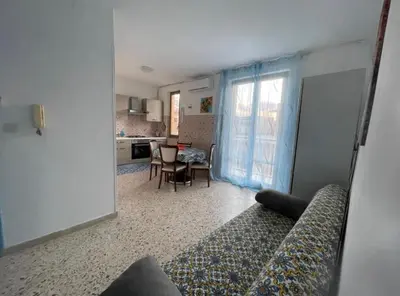 a living room with a couch and a table at Appartamento Ponente in Balestrate