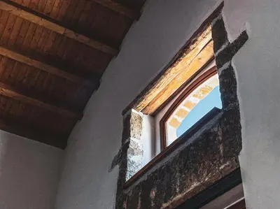 a window in a room with a wooden ceiling at Alla Riserva - Villa Riserva dello Zingaro - Scopello in Scopello