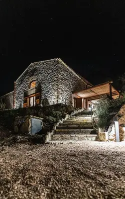a stone house at night with stairs in front at Alla Riserva - Villa Riserva dello Zingaro - Scopello in Scopello