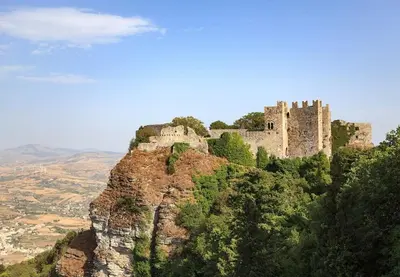 a castle on the top of a mountain at Cala Bianca (The One&Only) in Castellammare del Golfo