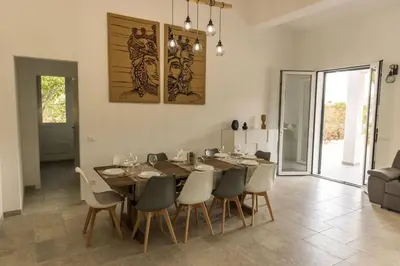 a dining room with a table and chairs at Villa Balata mare e relax in Balata di Baida