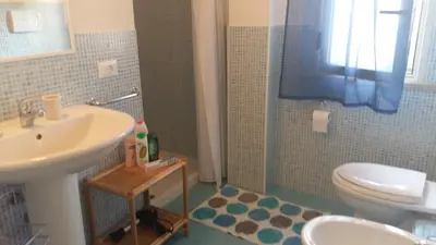 a bathroom with a sink and a toilet at La Casa sul Mare in Balestrate
