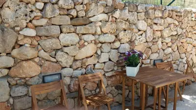 a gate with a dog inside of it at appartamento in villa splendente in Castellammare del Golfo