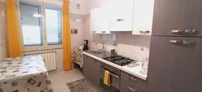 a kitchen with a sink and a stove top oven at Contessa Vacanze Byron in Contessa Entellina